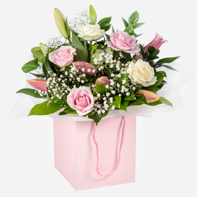 Strawberries & Cream
 - A beautiful collection of roses and lilies hand-tied and delivered in a gift bag or box.
