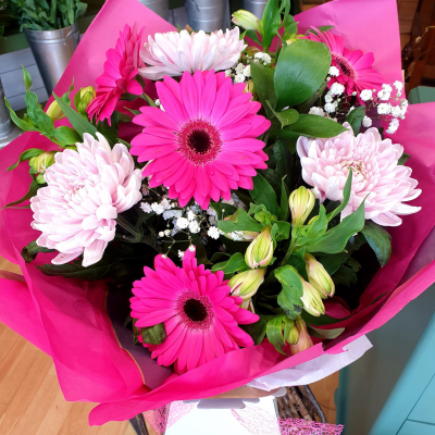 Splash of Colour - A vibrant gerbera posy hand-tied featuring a mix of colours carefully selected by the local florist. Hand-delivered in a gift bag or box.