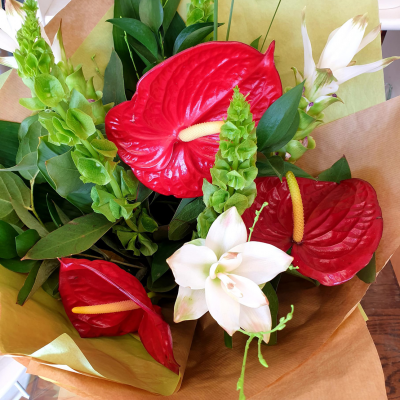 Hot Tropics - Ignite the passion with a unique, unforgettable romantic surprise of tropical flowers and foliage. PLEASE NOTE: this product may not be possible for same day delivery.