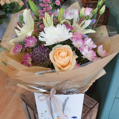 Penelope - A petite hand tied of pastel flowers makes a lovely gift for any occasion.